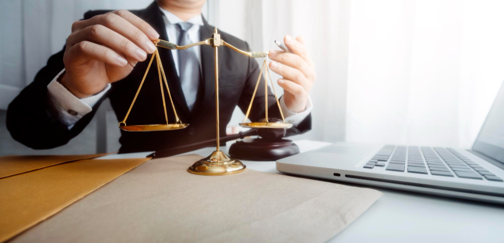 Business and lawyers discussing contract papers with brass scale on desk in office law legal services advice justice and law concept picture with film grain effect
