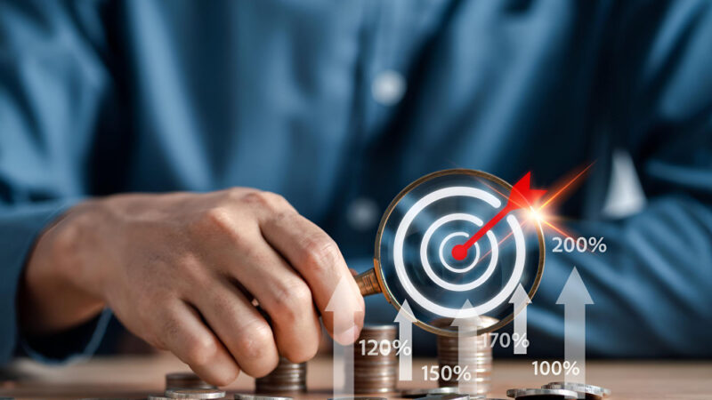 Businessman future target stacking money coins accounting for increase financial interest rate and business investment growth from dividend business finance and money save money concept