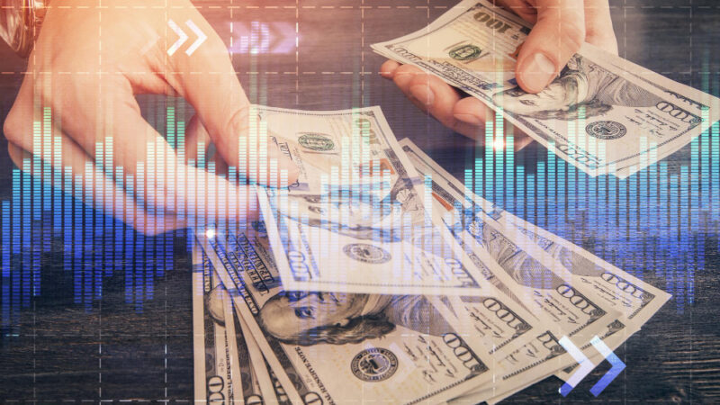 Multi exposure of financial graph drawing hologram and usa dollars bills and man hands analysis concept