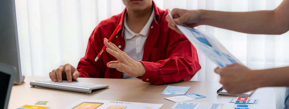Panorama banner of startup company employee planning on user interface prototype for mobile application or website in office ux ui designer brainstorm user friendly interface plan synergic
