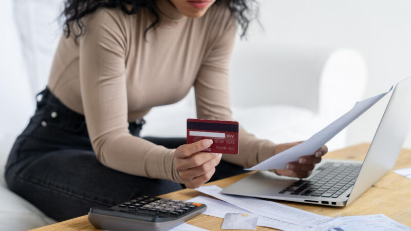 Stressed young woman has financial problems credit card debt to pay crucial