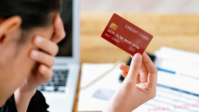 Stressed young woman has financial problems credit card debt to pay uttermost