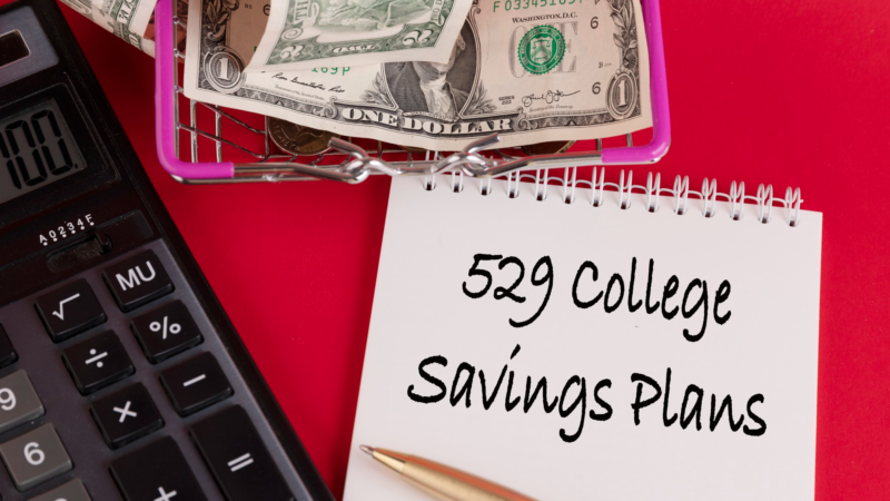 529 college savings plans, the text of the law is written in a white notepad with a calculator and a red background.